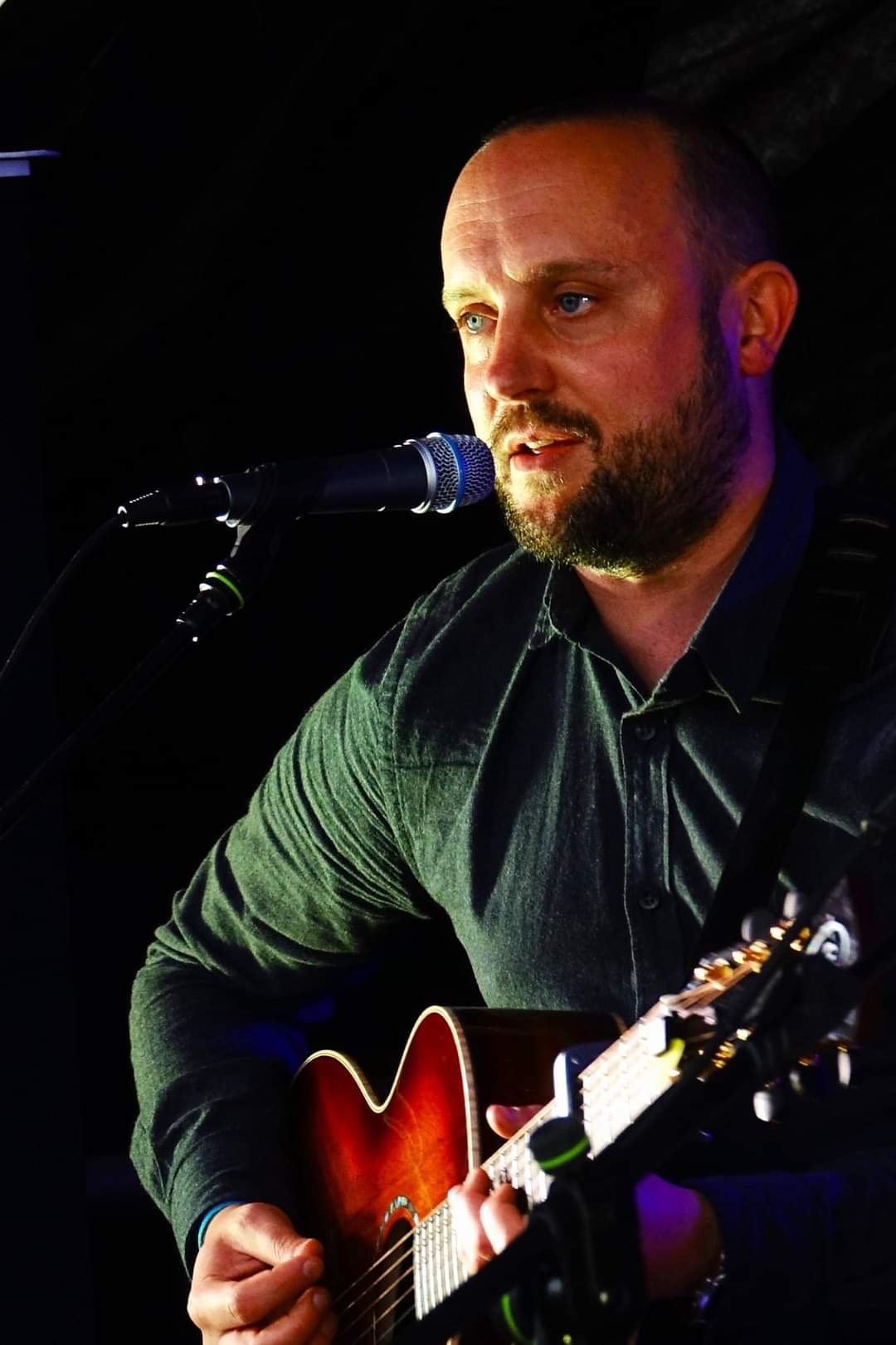 Close up Dave singing into mic
