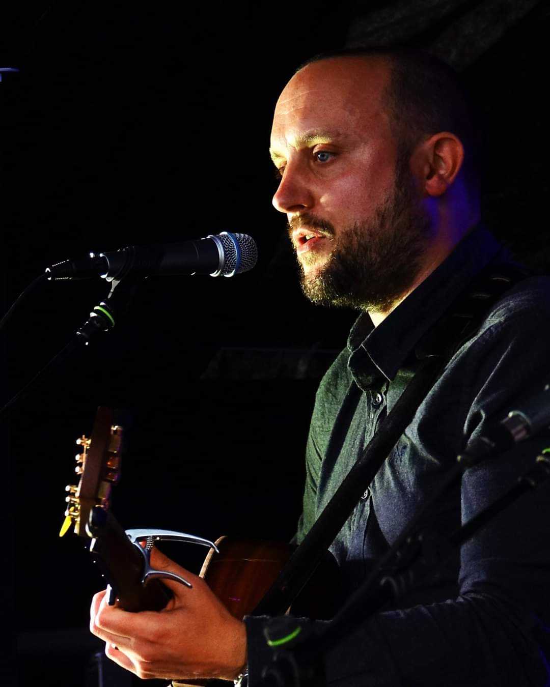 Close up singing and guitar